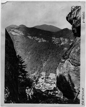 "Awe Inspiring Scenery, Showing Rugged Rock Formation at Chimney Rock." Photograph believe to be made by George Masa, not dated.  Published by the Asheville Postcard Company.  From the North Carolina Collection at Pack Library, Asheville, N.C.  Used by permission. 