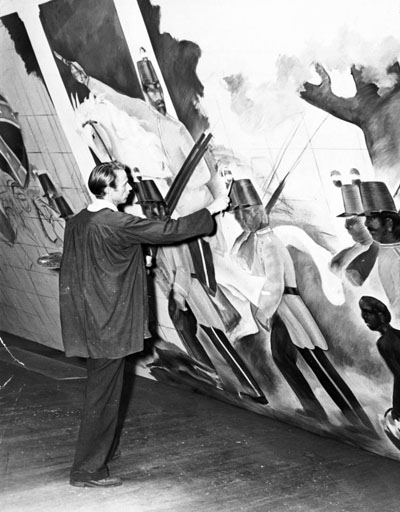 Photograph of James McLean painting a mural, Raleigh WPA Art gallery (date unknown).  From the Art Society Papers, State Archives of North Carolina.  Image used courtesy of the State Archives of North Carolina.