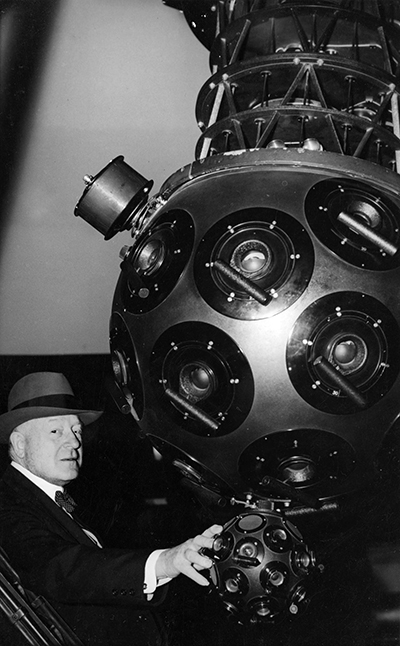 A photograph of John Motley Morehead, III in the Morehead Planetarium at UNC-CH. In 1946 he donated one million dollars for its construction, which was completed in 1949. Image from the North Carolina Collection Photographic Archives, University of North Carolina at Chapel Hill.