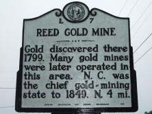 Reed Gold Mine's marker on SR 1100 (Reed Mine Road) west of Cabarrus/Stanly County line in Cabarrus county. Photo is presented on North Carolina Highway Historical Marker Program.