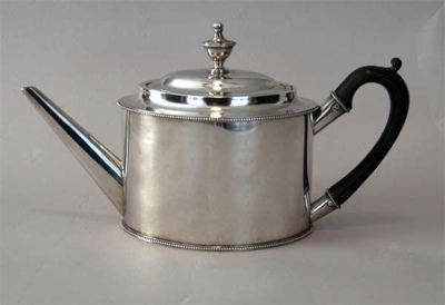 Photograph of silver teapot made by Freeman Woods, circa 1791-1810.  Item P.TP.2005.002.001, from Tryon Palace, New Bern, NC. 