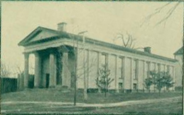 "Smith Hall, Library," from the University of North Carolina Yearbook <i>The Hellenian</i>, 1897.  Benjamin Wyche is considered the first professional librarian of the University of North Carolina and Smith Hall was used as the university library during his tenure as librarian.  Presented on DigitalNC. 