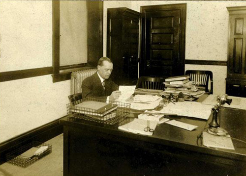 Willis Grandy Briggs seated at desk, 1913-1914. Image courtesy of the NC Museum of History. 