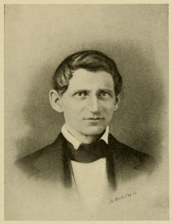 Portrait of Thomas Jefferson Holton. It is sepia print. He has coifed hair with a bow tie and dark jacket. He is concerned looking with no facial hair.