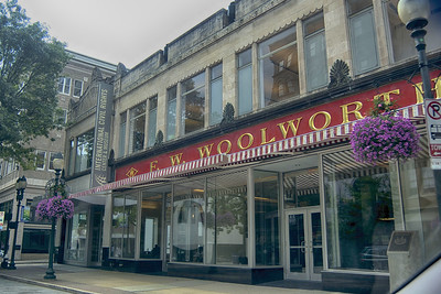 A storefront in a metropolitan downtown. It reads "Woolworth's." There is a small penant that also says "International Civil Rights Center & Museum."