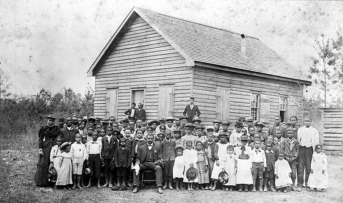 Professor Jacob's School, African-American, students and teacher in front of school, early 1900's, Lake Waccamaw, NC, Columbus County. From the General Negative Collection, North Carolina State Archives, call #:  N_89_1_71, Raleigh, NC.