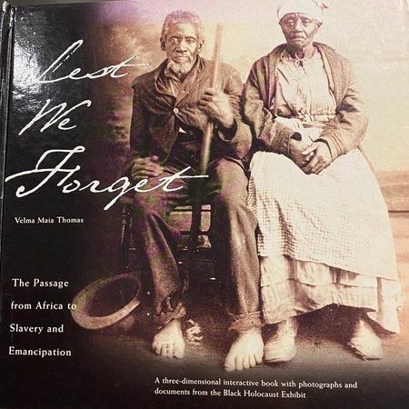 A three-dimensional interactive book with photographs and documents from the Black Holocaust Exhibit.
