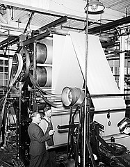 Combed Yarn Industry, NC, 1938. Cloth going through calendar rolls into finishing machine. Image courtesy of State Archiveso of North Carolina, call #: ConDev1821A.  