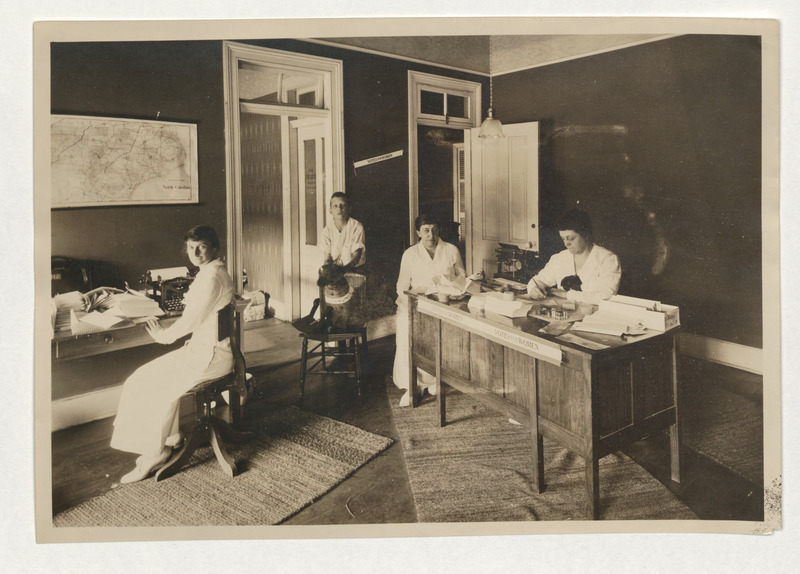 Photographs of the Equal Suffrage Association headquarters office, both inside (image 1) with Gertrude Weil standing to the left, and the facade outside (image 2) of 116 and 118 Fayetteville Street with banners of NC Equal Suffrage Association and States Rights Defense League of NC (the latter of the two was the anti--suffrage league organization).