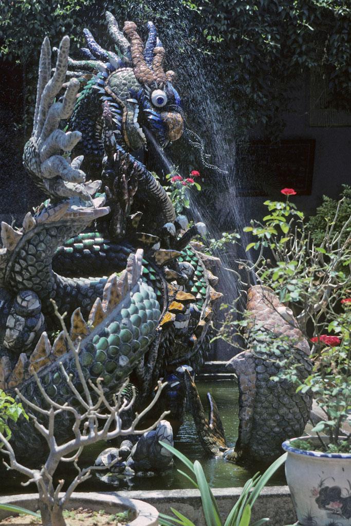 Dragon And Fish Statues In Garden Fountain Of Chinese Fukian Hall At 