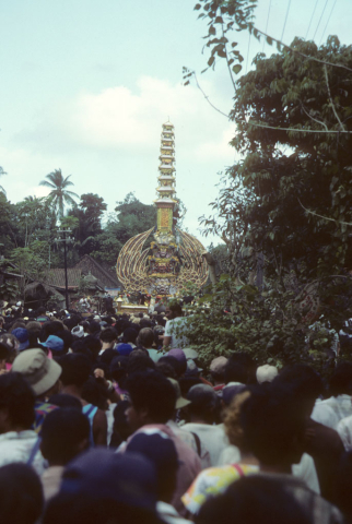 Large crowd watches huge cremation tower at funeral for high-ranked Balinese