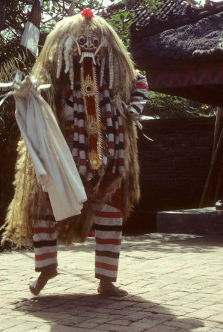 Balinese dancer advances in Rangda witch costume