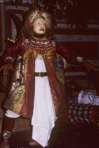 Balinese masked dancer performs character of old man