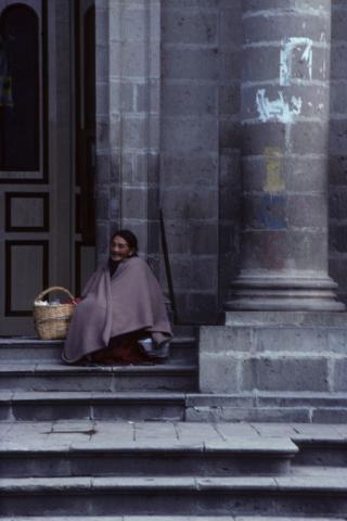 A Seated Woman in Front of a Church in Riobamba, Ecuador