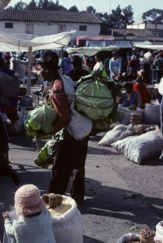 A produce vendor the market of Saquisilí, Ecuador