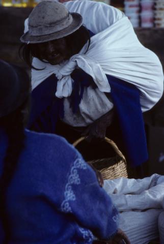 A woman carrying a bundle in Saquisilí, Ecuador