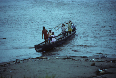 Landing a canoe on the Napo river near Misahualli, Ecuador