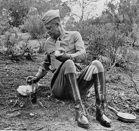 Gen. Dwight Eisenhower eating a C-ration