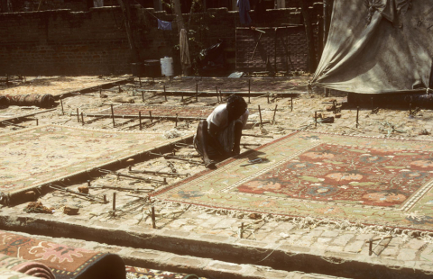 Stretching carpets in Agra, India