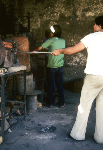 Glass-blowing artists at work in Tlaquepaque, Mexico