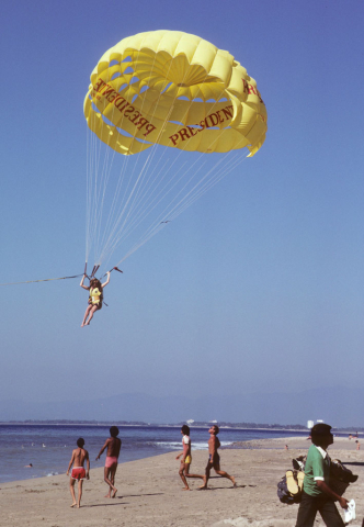 Parasailor landing on the beach at Puerto Vallarta, Mexico