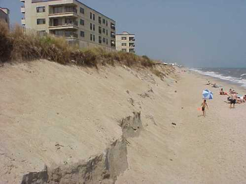 Multifamily housing behind a large Fran-eroded dune