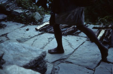 Feet on the move in a western mountain trail in Nepal