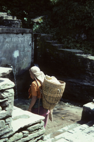 Nepali woman at a community water tap