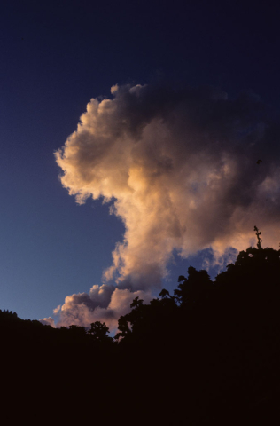 Clouds hover over a mountain 