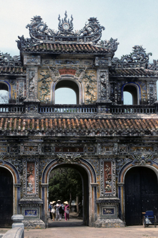 Ornately carved and painted Women's Gate into the Imperial City at Hue