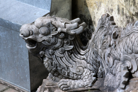 Stone dragon hand rail by stairs inside Imperial City at Hue