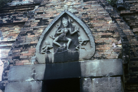 Detail carving of dancing Hindu deity and musicians on Cham tower at Nha Trang