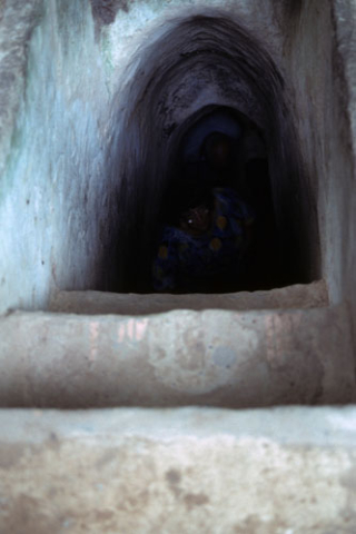 Steps and arched walkway inside Vietnam War tunnel at Cu Chi