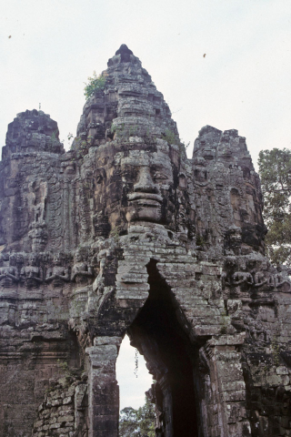 Face on top of south gate tower of Bayon Temple at Angkor Thom