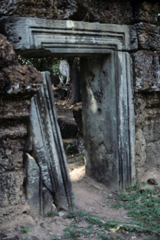 Broken stone doorway at Ta Prohm site at Angkor